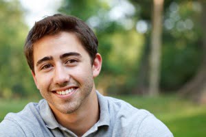 young-man-smiling-outside.jpg